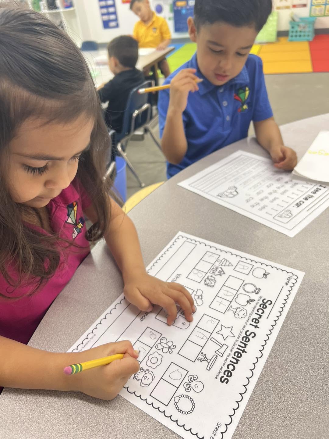 Adinvita students concentrating on a classroom activity together